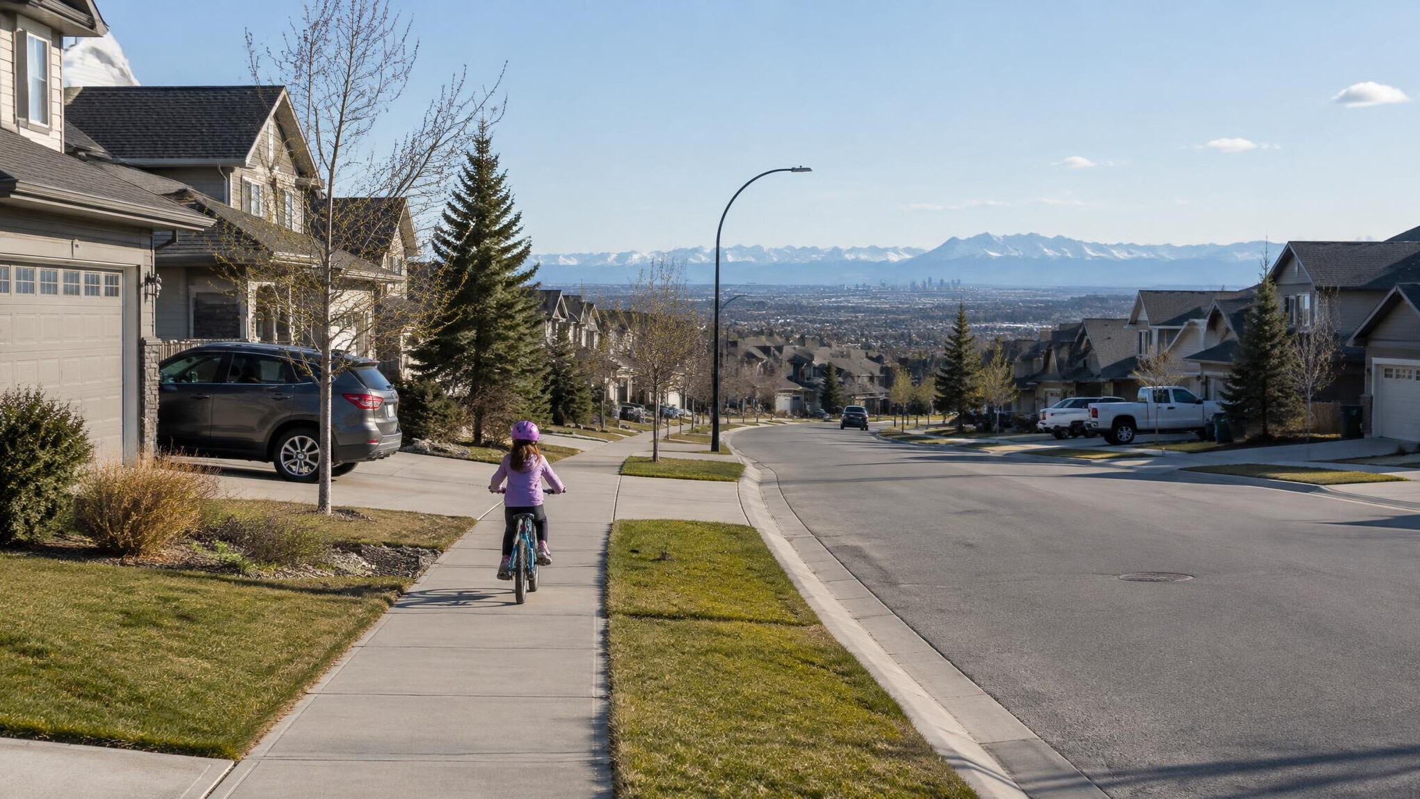 Quiet suburban street with detached houses on the outskirts of Calgary